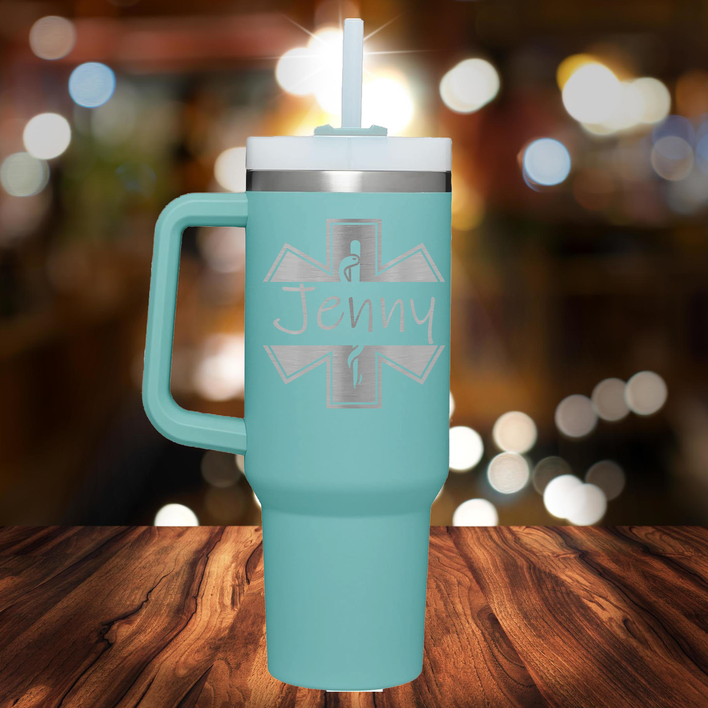 a blue travel mug with a cross on it